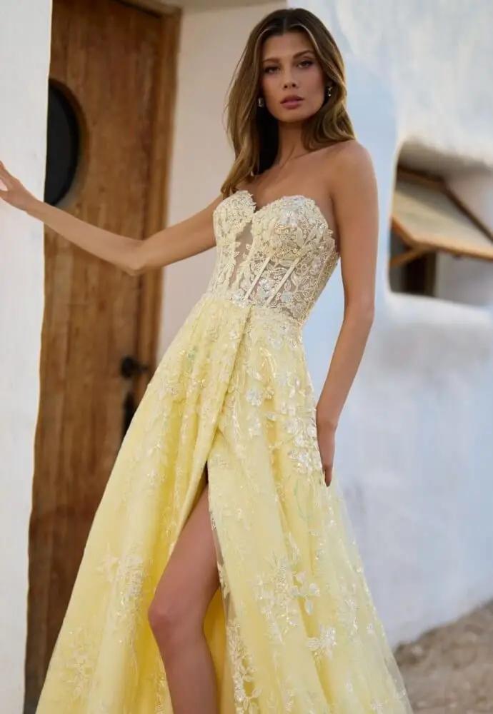 model wearing yellow Sherri Hill dress